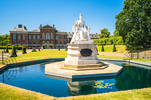 June 30, 2018: Statue of Queen Victoria near Kensington Palace in London, England, UK.  It was sculpted by Princess Louise, Duchess of Argyll and erected in 1893 and made from white marble.
