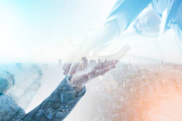 istock businessman shaking hands and big city 1305449258