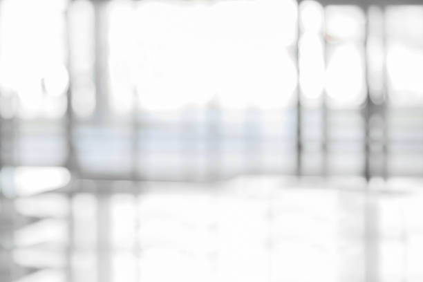istock blurry image of an office with glass walls 1305449894