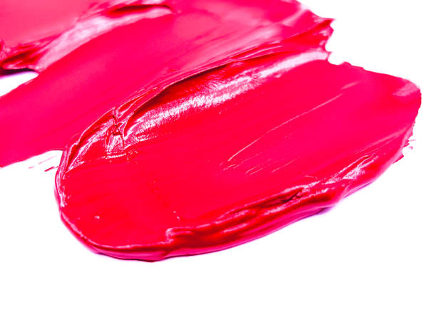 istock Red lipstick smear smudge on white, women's lips, love background, cosmetics composition, make up composition, lipstick brush strokes 1305451797
