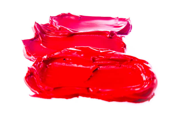 istock Red lipstick smear smudge on white, women's lips, love background, cosmetics composition, make up composition, lipstick brush strokes 1305451832