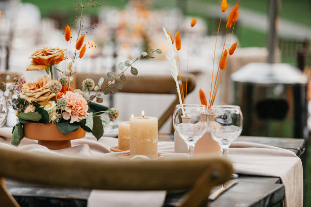istock Several small bouquets of flowers to decorate table in Boho style 1305452530