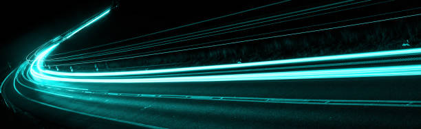 istock blue car lights at night. long exposure 1305452693