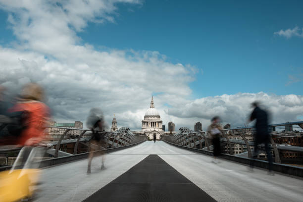 istock St Paul and walking people on the Millennium Bridge 1305454241