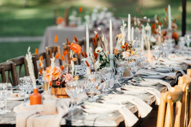 istock Luxury wedding reception, dining table setup with decoration on rustic wooden table 1305455303