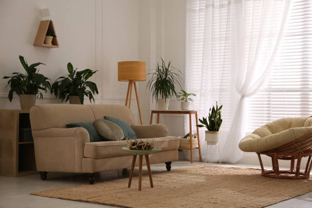 istock Stylish living room interior with comfortable sofa and cushions 1305457119