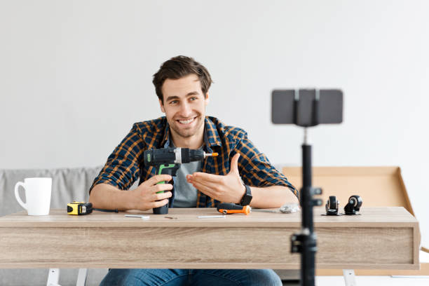 istock Popular blogger makes video about construction, renovation and assembling furniture 1305458355