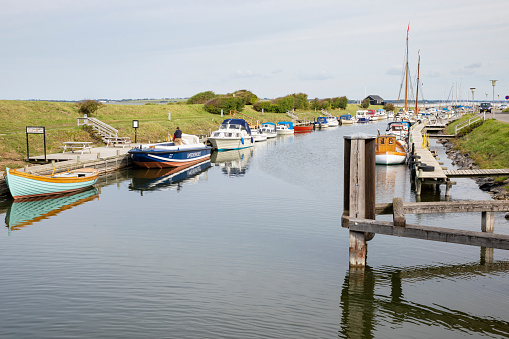 Løgstør, Denmark - September 3, 2020: Variety of boats moored in the defunct Frederik VII's canal next to the Limfjord inlet