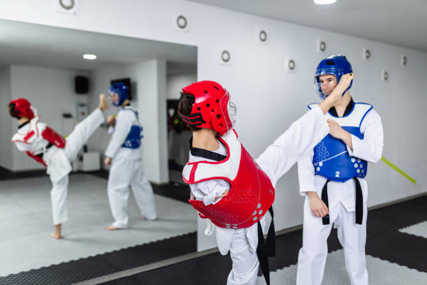 istock Disabled woman training taekwondo with her coach. 1305460518