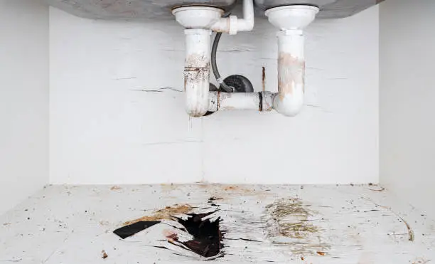 Photo of Home problems, Damaged water leak out from piping under sink in the kitchen