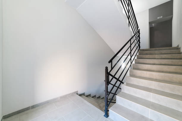 istock handmade metallic black railings and gray tiled stairs 1305460667