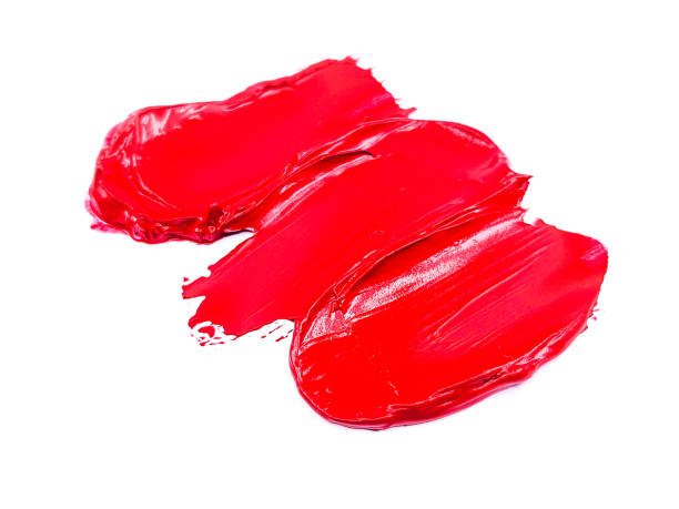 istock Red lipstick smear smudge on white, women's lips, love background, cosmetics composition, make up composition, lipstick brush strokes 1305460722