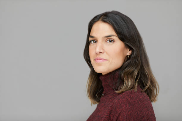 Headshot studio portrait of a woman in profile looking at the camera. Studio portrait of a young woman shot against a plain background.
Made in Barcelona.
Spanish model. pics of portuguese women stock pictures, royalty-free photos & images