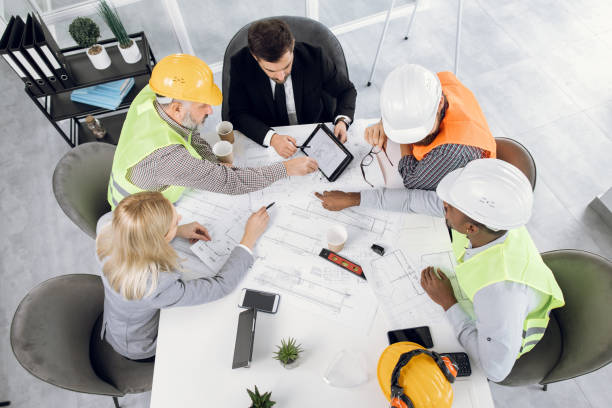 istock Construction team planning arrangement of service lines 1305462769