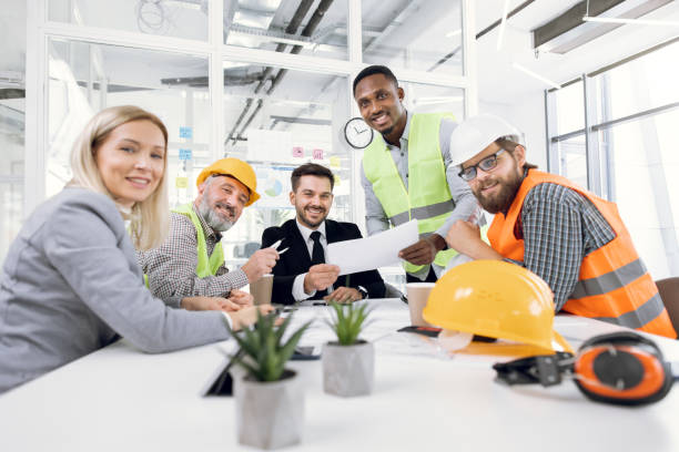 istock Architects, designers and engineers having working meeting 1305462873