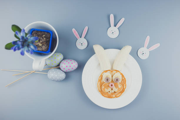 istock Funny Easter bunny pancakes, breakfast for a child. Pancake with banana. 1305463012