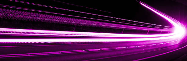 istock violet car lights at night. long exposure 1305463810