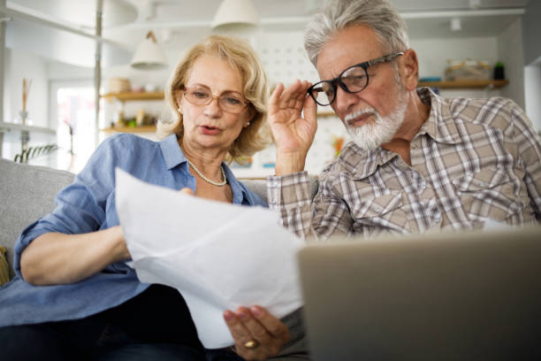 istock Senior couple having problems with home finances 1305463818