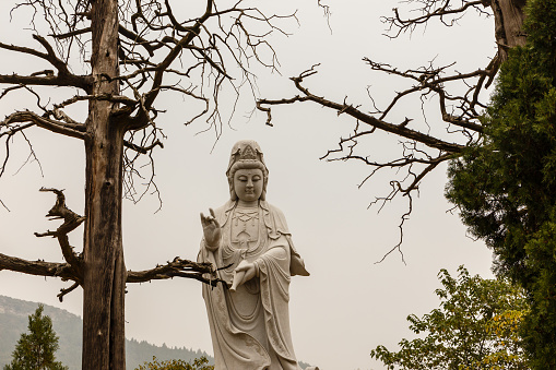 Dengfeng, China - October 17, 2018: Statue at Shaolin Monastery. Ganlu platform, also called platform for translating Buddhist sutra.