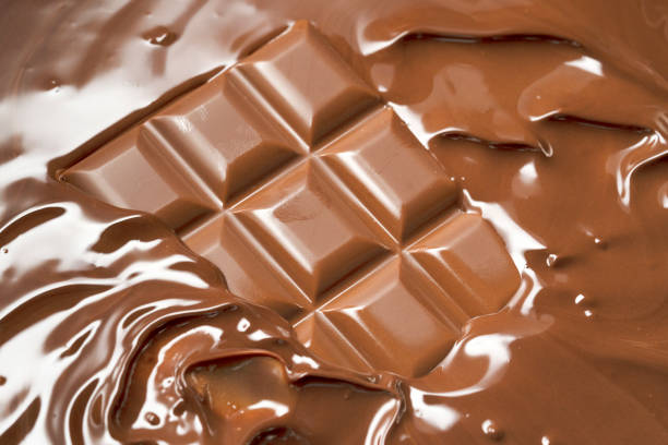 chocolate - chocolate chocolate candy dark chocolate pouring imagens e fotografias de stock