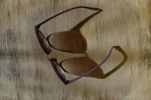 istock sunglasses on wooden background 1305467068
