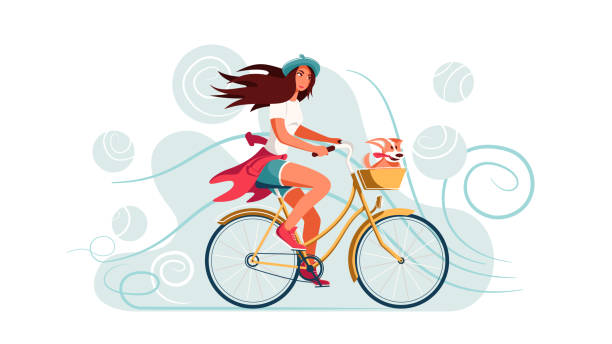 istock A young woman rides a bicycle with a dog in a basket. 1305467954