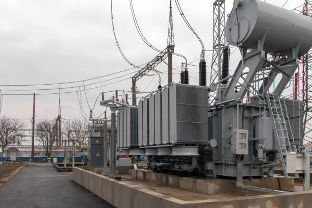 istock Electrical transformers: equipment used to step up or step down voltage, high voltage power plant. Side view. 1305472340