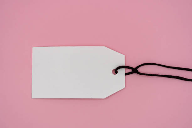 istock Multiple blank white tag price on  pink background 1305473804