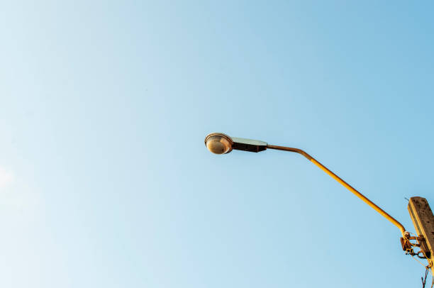 istock Street lamp in the sky background 1305474282