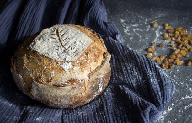 istock Long-fermented sourdough loaf top view photo. 1305475453
