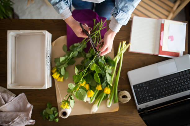 istock Top view of a woman making a bouquet 1305475782