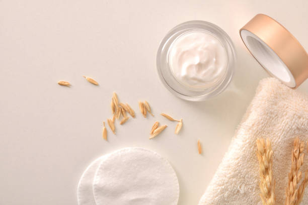 istock Oat moisturizer cream acne treatment with spikes on white top 1305475919
