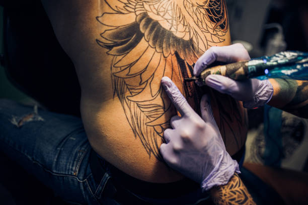 istock Tattoo Artist 1305477259