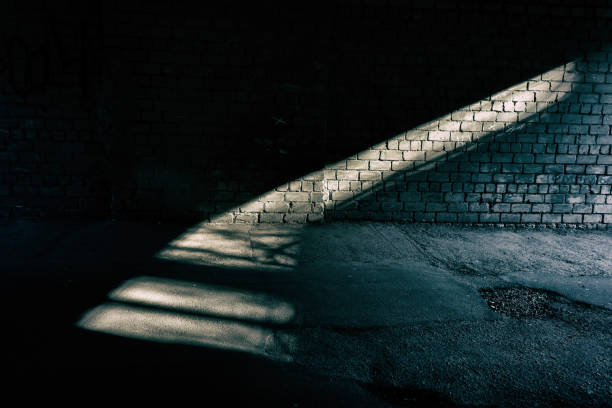 istock streak of light on a brick wall in a tunnel. 1305477573