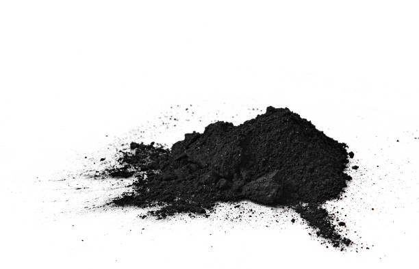 istock Black bamboo activated charcoal powder isolated on white background 1305477860