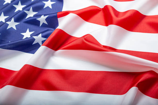 istock Beautifully waving star and striped American flag 1305480892