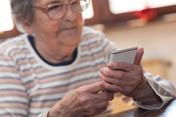 istock Elderly woman and new technologies 1305481156