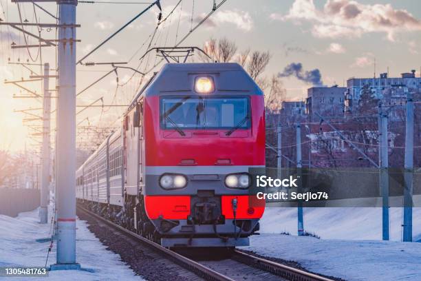 Passenger Train Moves From The Station Stock Photo - Download Image Now - Train - Vehicle, Russia, Winter