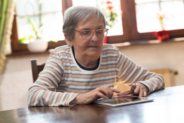 istock Elderly woman and new technologies 1305481772