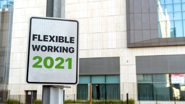 istock Flexible working 2021 sign in downtown city setting 1305481932