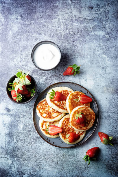 istock Pancakes decorated with strawberries in a plate 1305483564