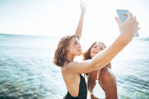 istock friends take a selfie at the seaside 1305483635
