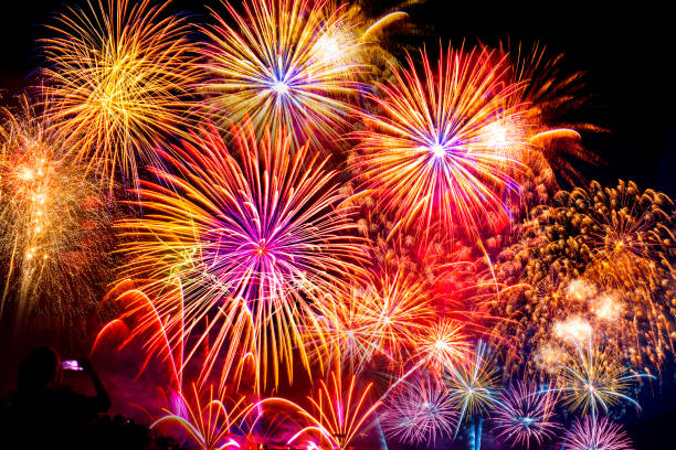 istock The crowd of Silhouette watching firework isolated display for celebration happy new year and merry christmas on black isolated background 1305485270