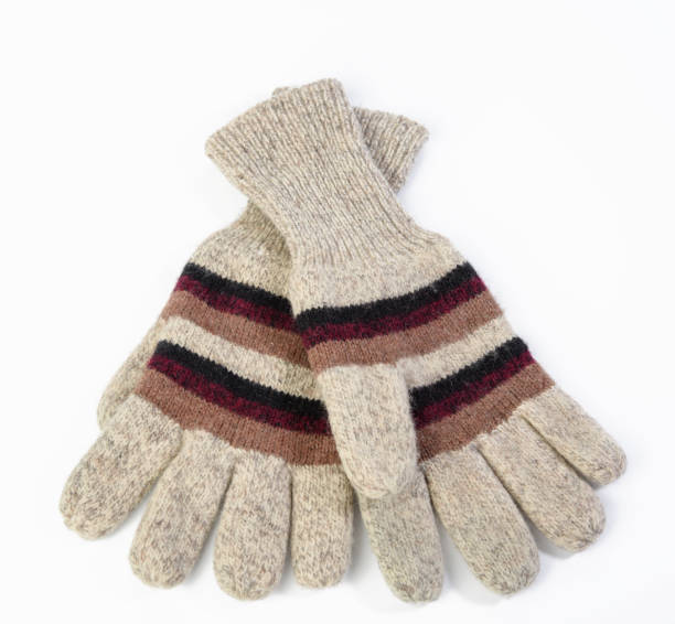 istock knitted woolen mitten from gray threads on white background, close up 1305486280
