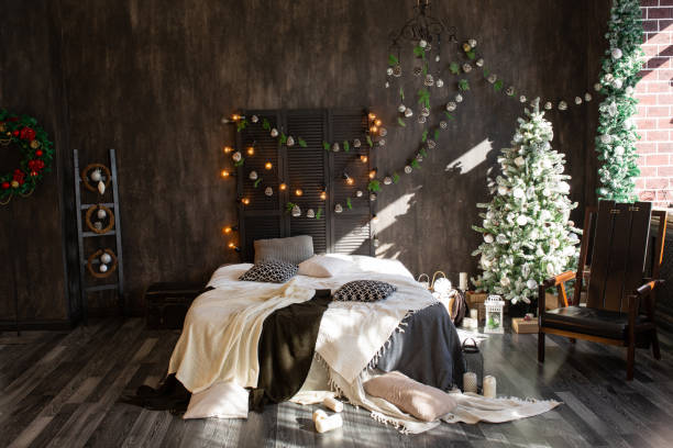 istock The bedroom decorated by Christmas. Cozy dark interior 1305486747