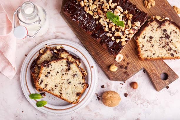 Pound cake with chocolate walnuts and hazelnuts Pound cake with chocolate walnuts and hazelnuts. Delicious homemade dessert. fruitcake stock pictures, royalty-free photos & images