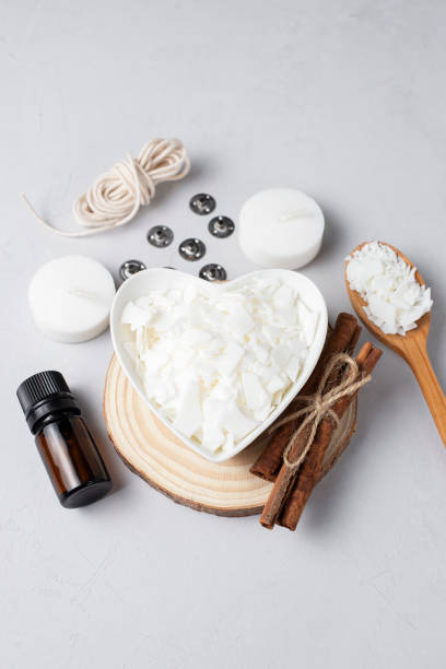 istock Basic set for home-made natural white eco soy wax candles in glass, wick, perfume. Idea for a hobby, business. Making trendy diy candles without harm to health on white background. 1305492198