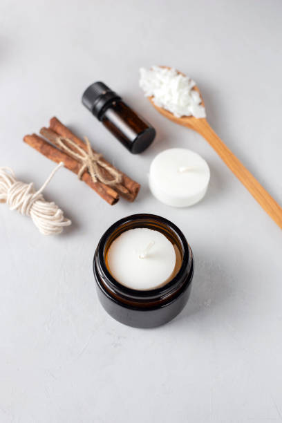 istock Basic set for home-made natural white eco soy wax candles in glass, wick, perfume. Idea for a hobby, business. Making trendy diy candles without harm to health on white background. 1305492203