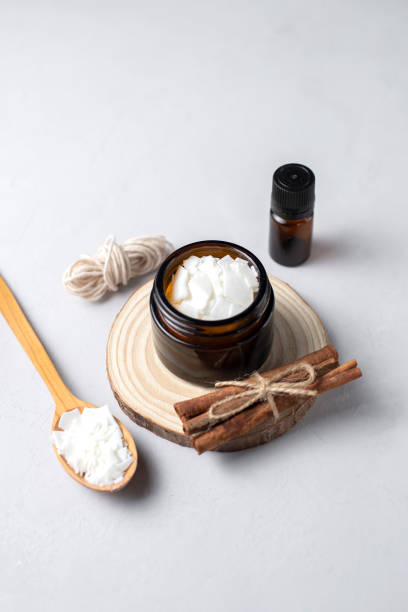 istock Basic set for home-made natural white eco soy wax candles in glass, wick, perfume. Idea for a hobby, business. Making trendy diy candles without harm to health on white background. 1305492216
