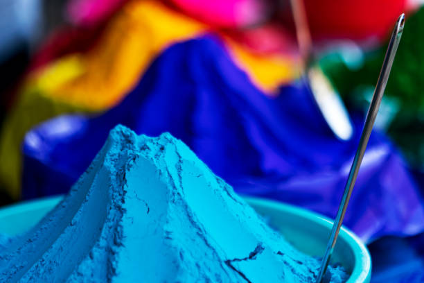 Vendor selling various colors of holi powder, gulal, abir on a market. Concept for Holi preparation. Stock image for background, graphic resources, flyer, poster, cover.